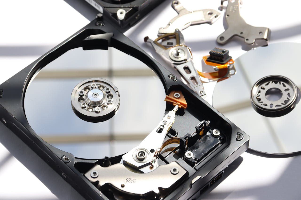 services-10 Detailed view of disassembled HDD showing intricate internal components.